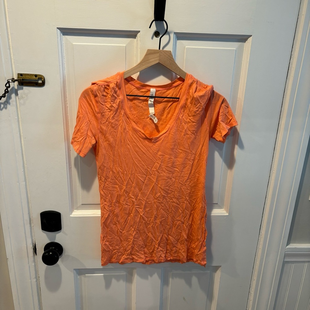 Lululemon Orange Tshirt with slit up right side